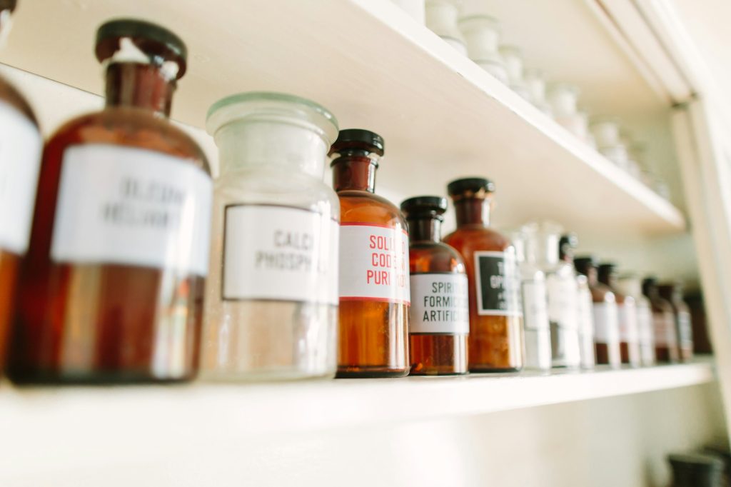 Shelves with bottles of drugs in ancient drugstore